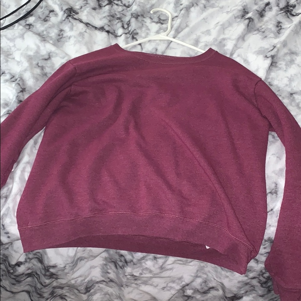 this is a reddish purple sweatshirt no hoodie